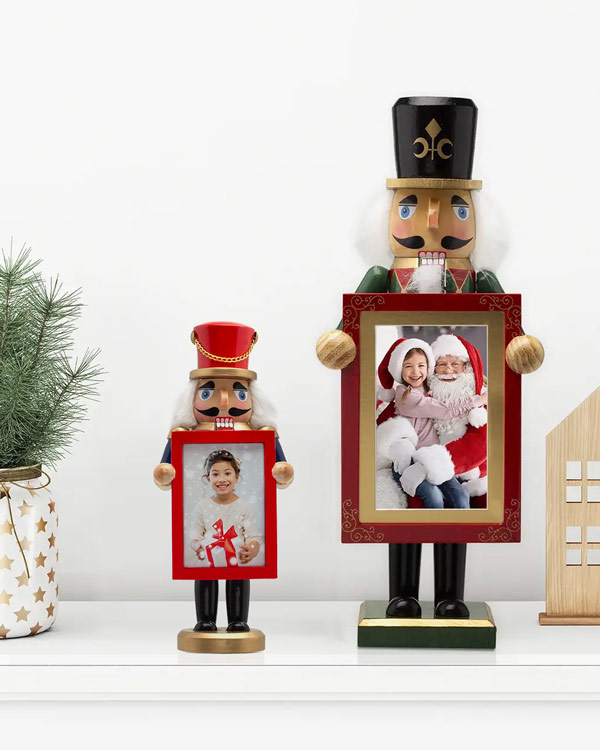 Festive nutcracker photo holders displaying holiday photos