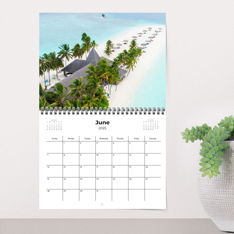 Personalized calendar hanging on wall with a beach scene